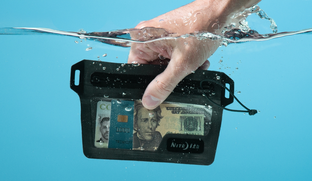 RunOff Waterproof Wallet being dunked in water