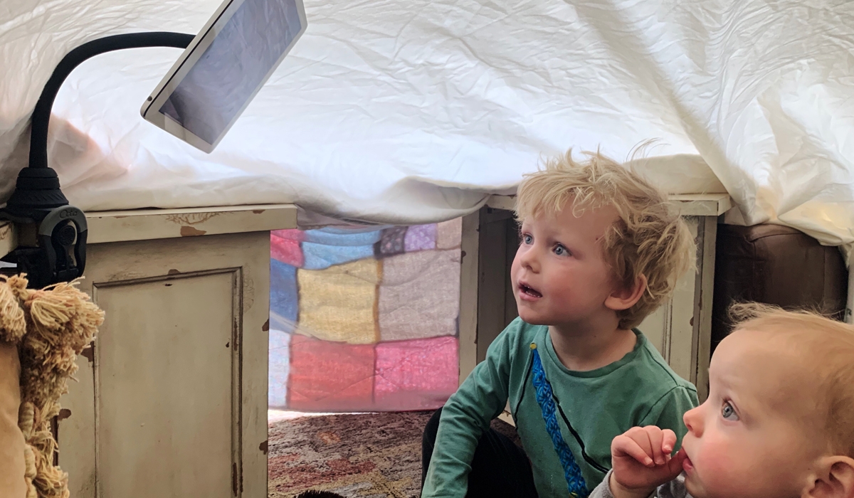 kids watching TV in fort