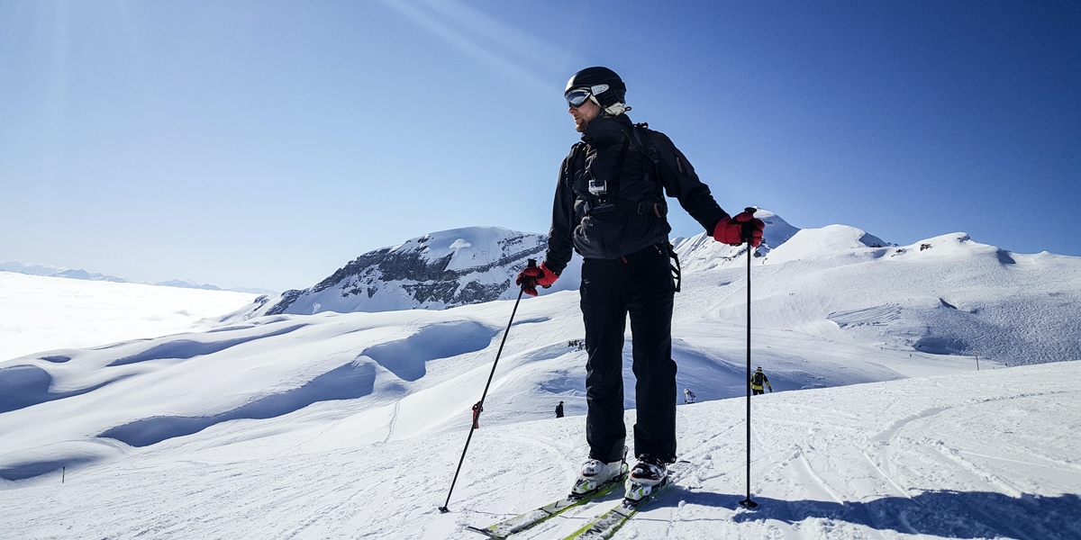 Standing on a ski slope with RunOff Waterproof Wallet