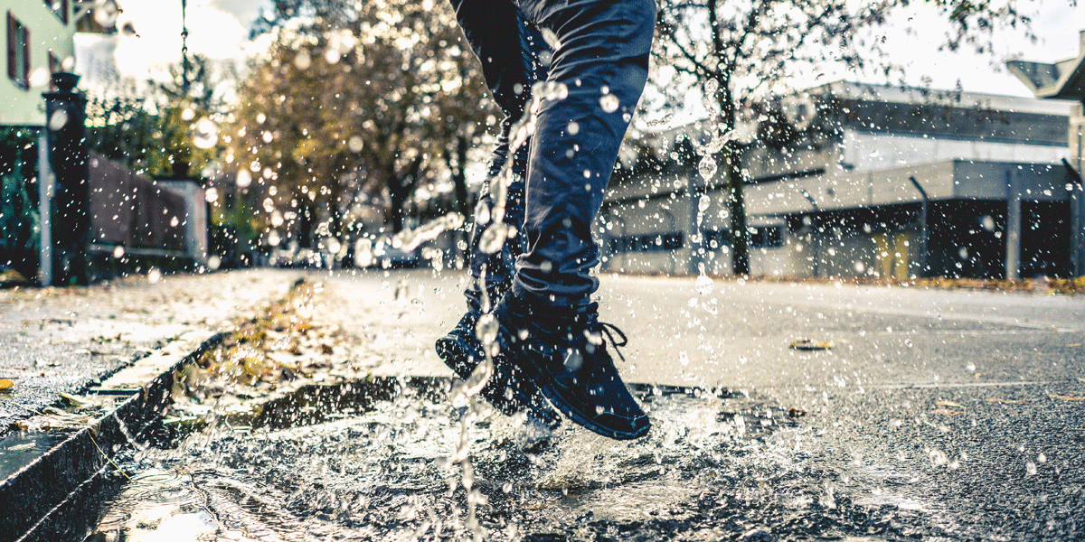 Person splashing in a puddle