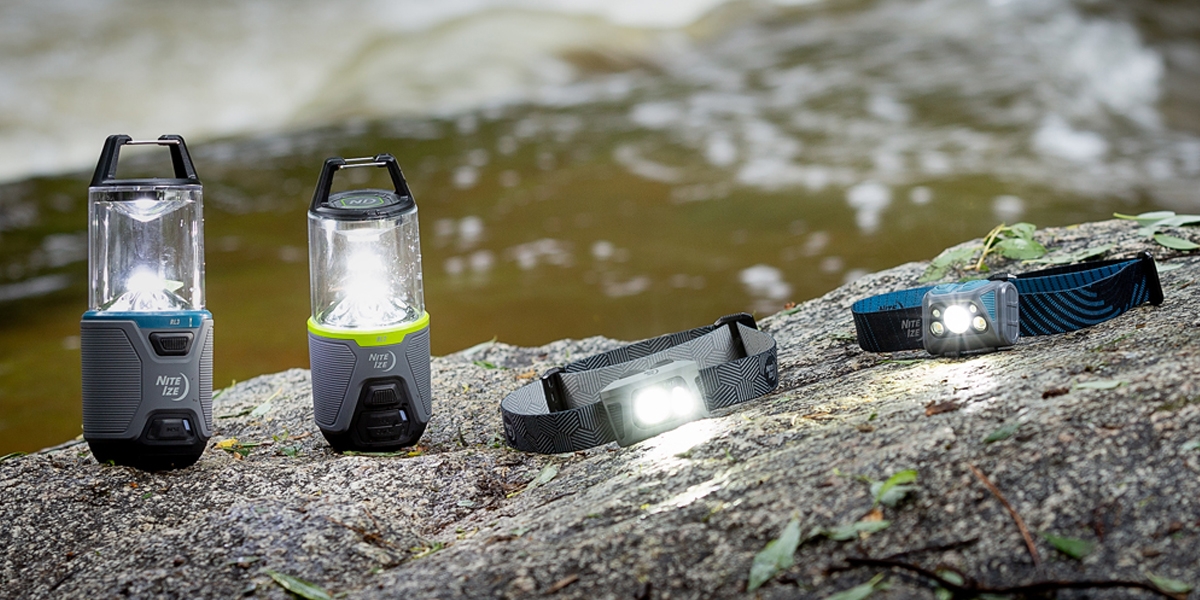 Lanterns and headlamps sitting on a boulder