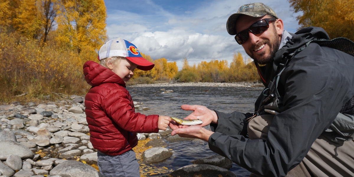 Dad fishing with child