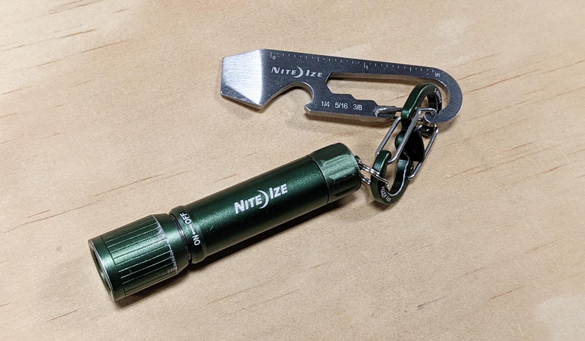  DoohicKey Key Tool and Radiant 100 Keychain Flashlight on table