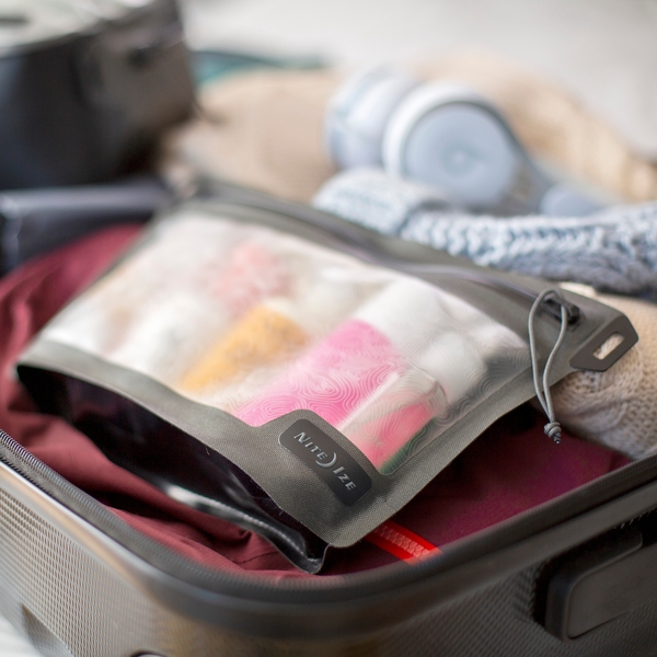 runoff pouch holding toiletries in suitcase